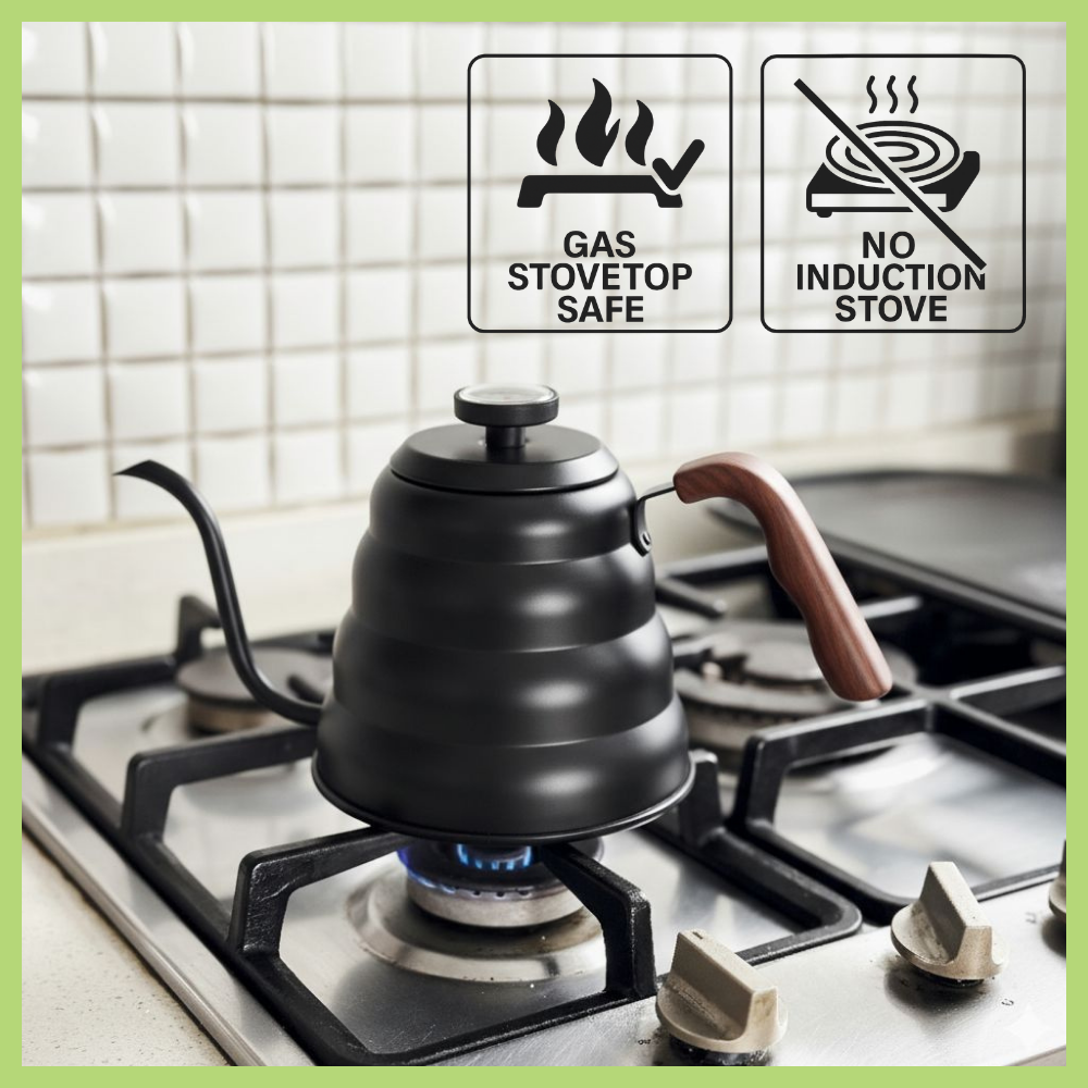Black gooseneck kettle on a gas stovetop with safety labels indicating it is safe for gas stovetops but not induction stoves.