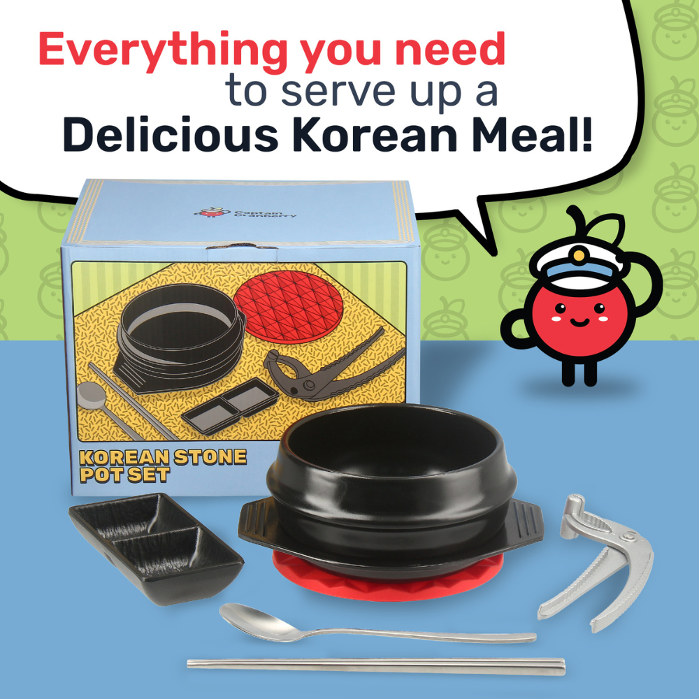 Korean stone pot set with packaging and utensils on a blue background