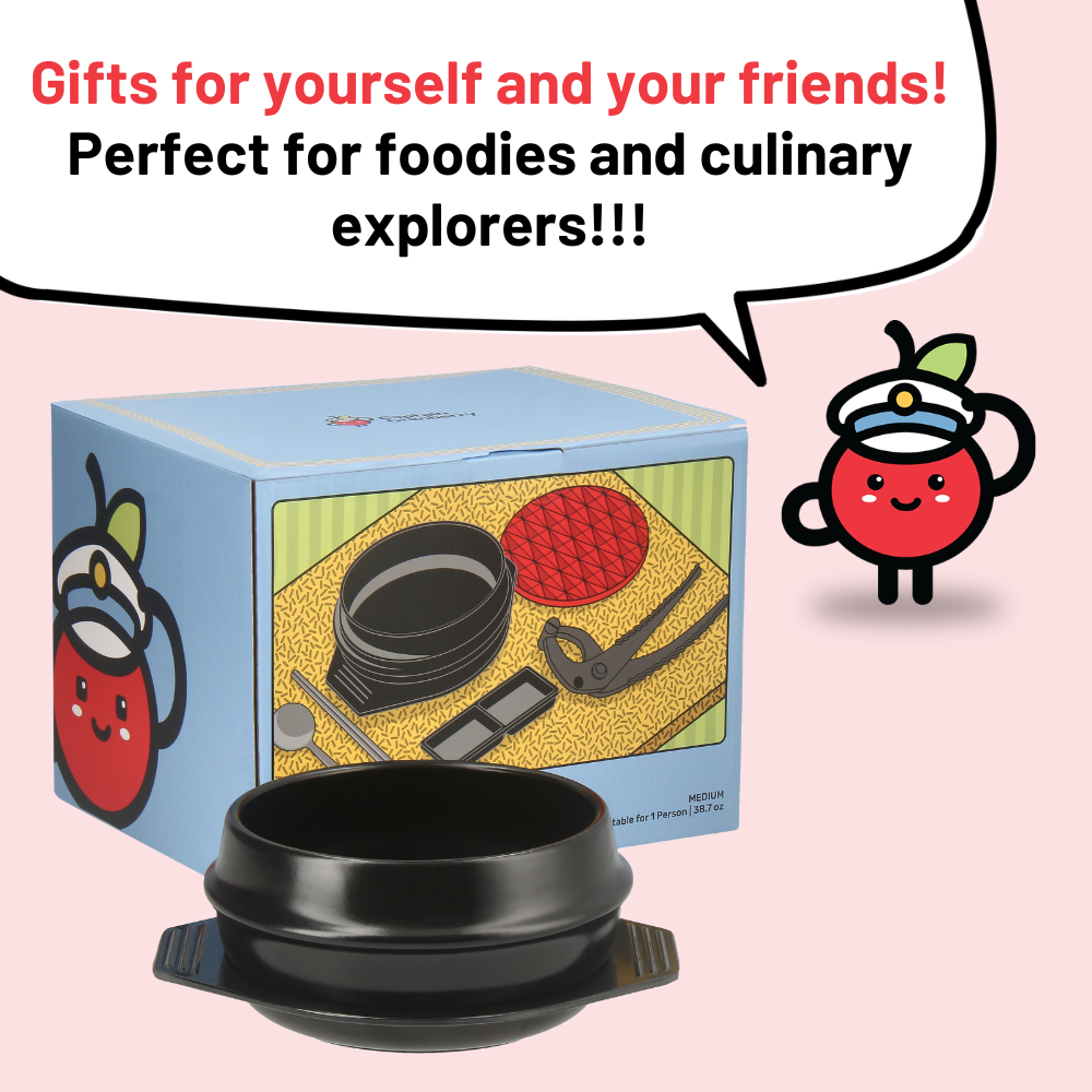 Black bowl with a blue box featuring illustrations and a cartoon character on a pink background.