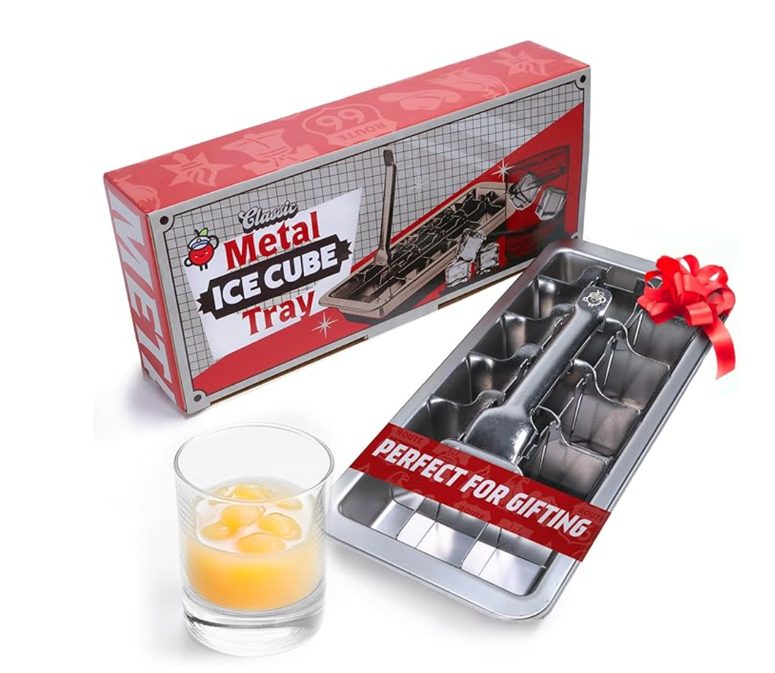Metal ice cube tray with packaging and a glass of cocktail with ice cubes on a white background